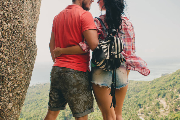 young couple in love standing on mountain, landscape background, - Photo, Image