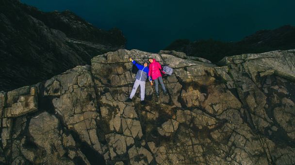 Couple in love on cliff in Norway - Foto, Bild