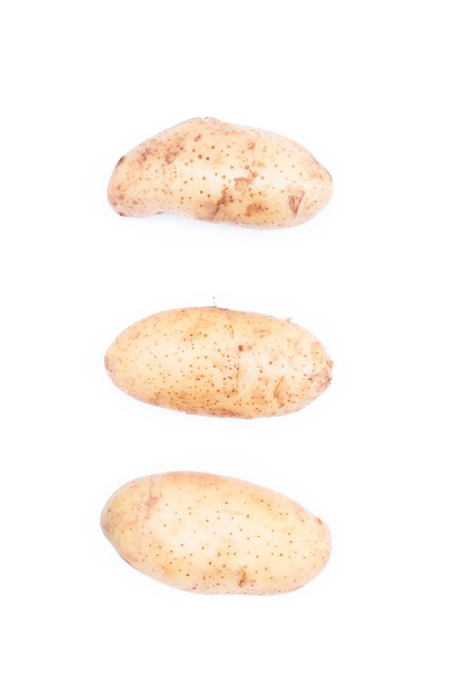 három nyers burgonya, fehér háttér - Fotó, kép