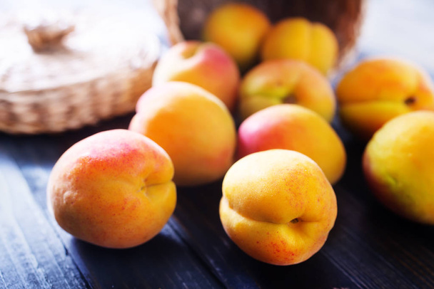 fresh peaches on wooden table - Фото, изображение