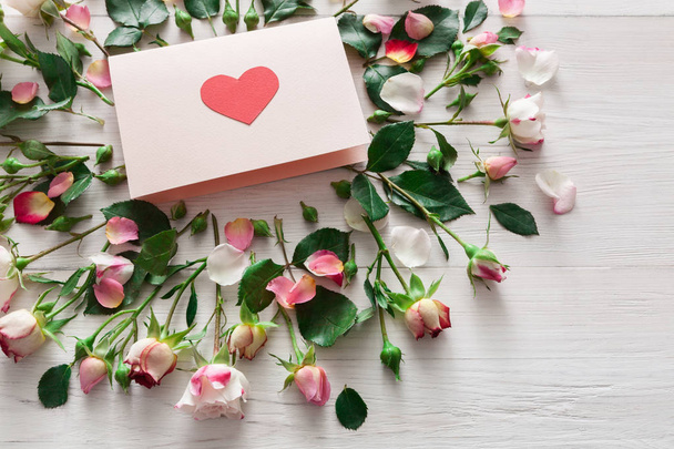 Valentine day background, heart card and flowers on white wood - Photo, Image