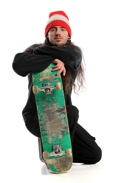 Skateboarder Posing With Board - Foto, imagen