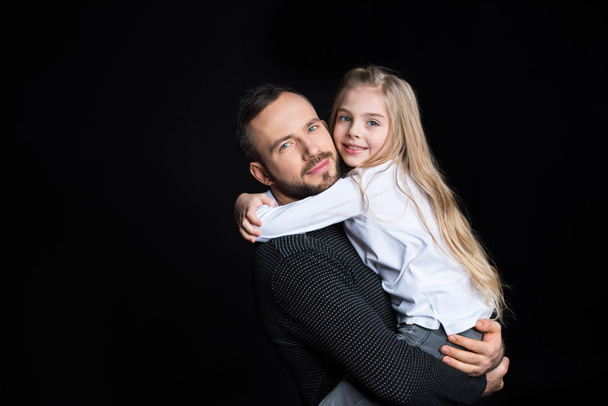 Father holding his daughter - Foto, Bild