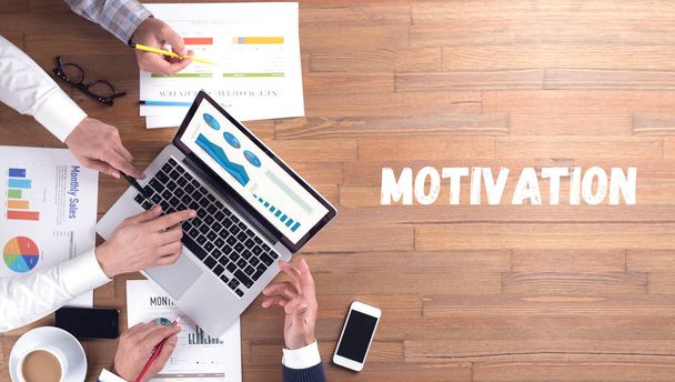 MOTIVATION word concept on desk background - Foto, Imagen