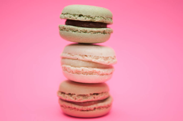 Macaroons close up on a pink background, selection of macaroons - Fotó, kép