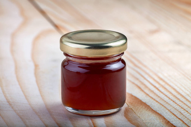 a jar of Maroon jam - Фото, зображення