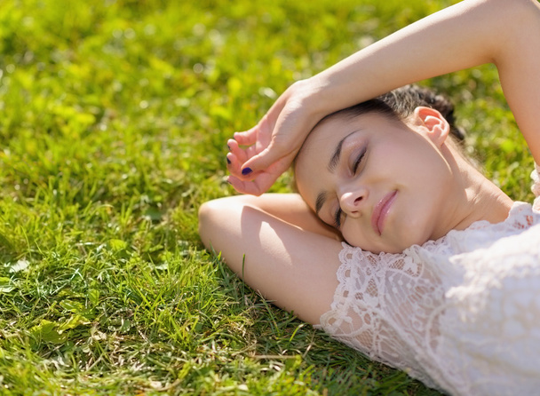 Young woman relaxing on grass - Foto, Imagem