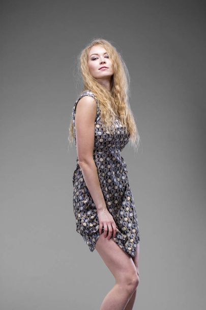 Young blond lady in sexy dress - Fotó, kép