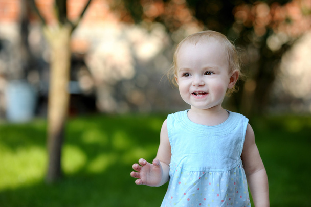 Adorable toddler girl in blue dress - Foto, Imagen