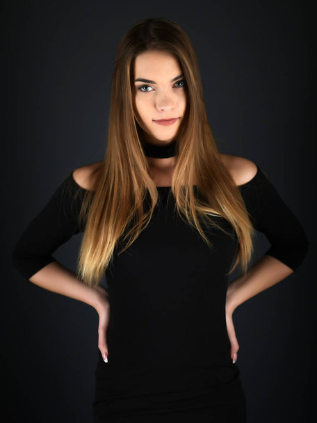 Beautiful sexy white woman in black dress posing at studio - Fotografie, Obrázek