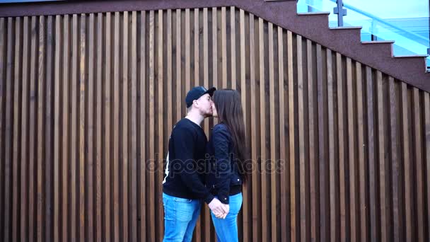 Enamoured go Forward and Happy to see each other, Gently Kissing and Hugging on Background of Restaurant Stairs Outdoors in Daytime
. - Кадры, видео