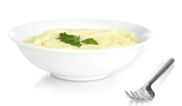 Картопляне пюре з петрушкою в тарілці ізольовані на білому
 - Фото, зображення