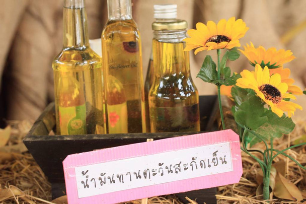 Sunflower oil with flower - Photo, Image