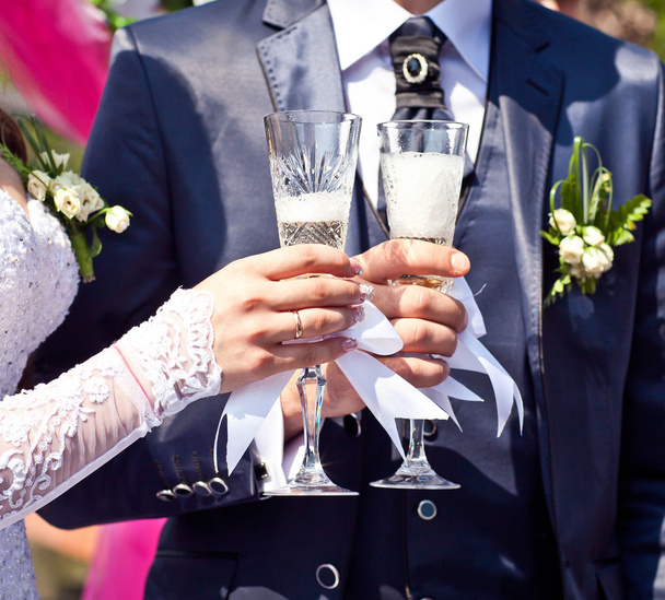 Glasses with champagne in hands - Photo, Image