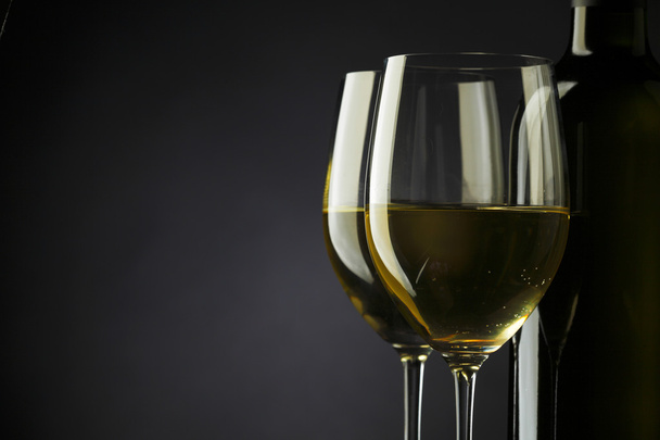 white wine glass silhouette black background - Foto, immagini