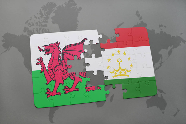 παζλ με την εθνική σημαία της Ουαλίας και του Τατζικιστάν σε έναν παγκόσμιο χάρτη - Φωτογραφία, εικόνα