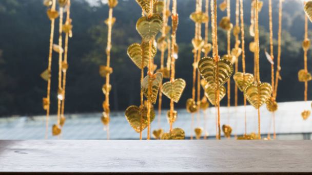 Gold pho leaves hanging on golden tree (blur image) with selecte - Photo, Image