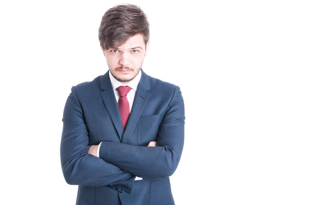 Young man wearing suit posing with arms crossed - Photo, Image