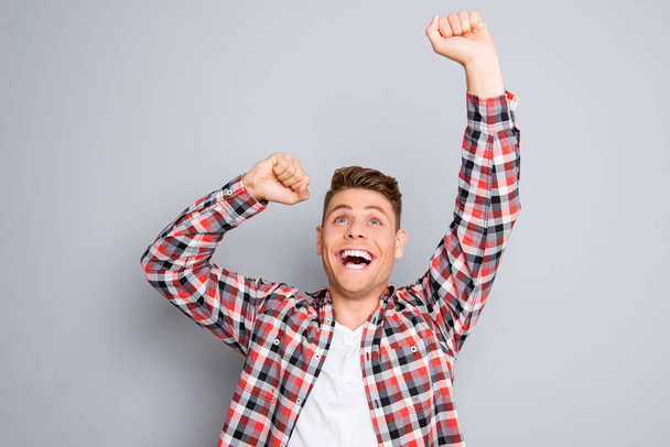 Excited happy successful man triumphing with raised hands - Photo, Image