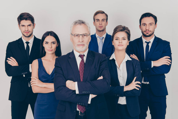 Six  business professionals with crossed hands standing together - Foto, afbeelding