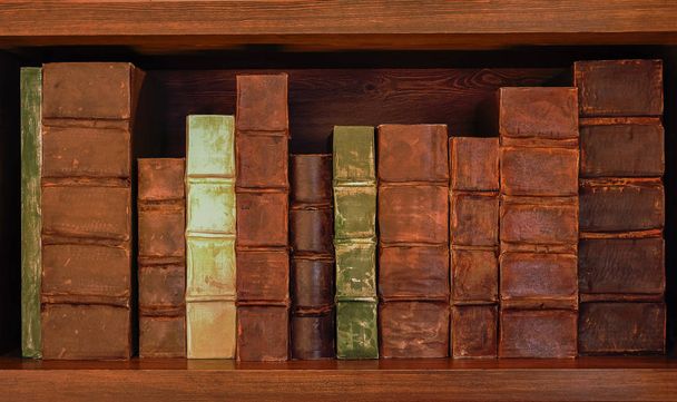 Antique books on old wooden shelf. Shelf with old books. - Photo, Image