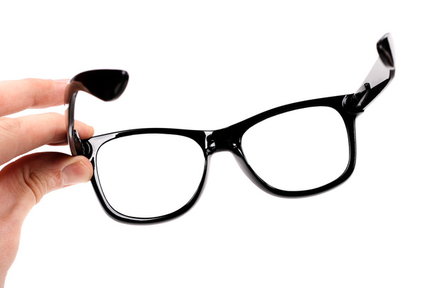 Hand mit schwarzer Brille isoliert auf weißer - Foto, Bild