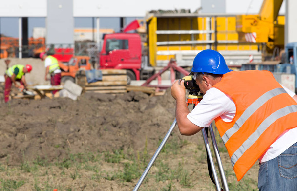 Surveyor engineer at construction site - Photo, Image