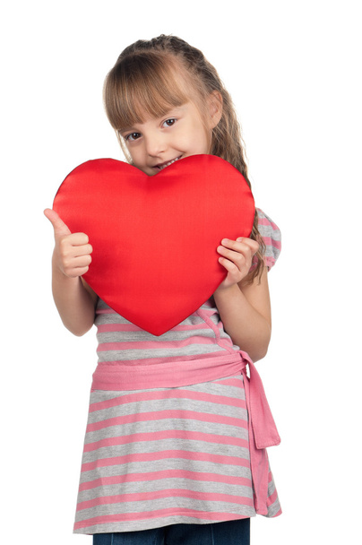 Little girl with red heart - Φωτογραφία, εικόνα