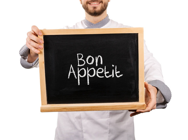 Bon appetit tekst op blackboard - Foto, afbeelding