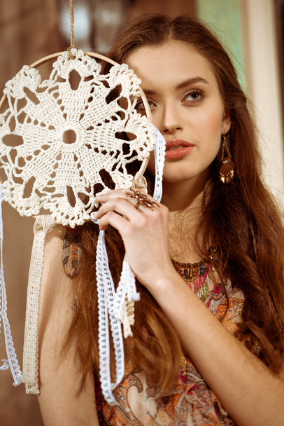 Young bohemian woman holding dreamcatcher - Photo, Image