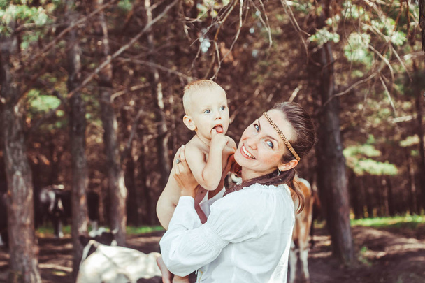 mother with baby in the woods - Photo, Image
