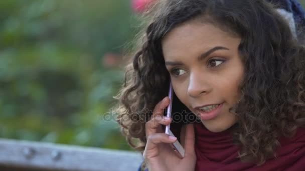 Smiling lady in elevated mood calling family to share good news, face close-up - Footage, Video
