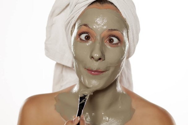 woman with a mud mask - Φωτογραφία, εικόνα