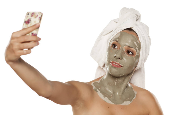 woman with a mud mask - Photo, Image