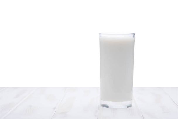 Glass of milk on a table  - Photo, image