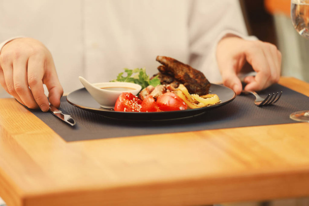 Client eating tasty dish in restaurant - Foto, imagen