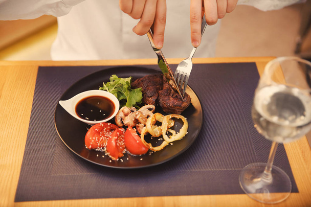 Client eating tasty dish in restaurant - Foto, imagen