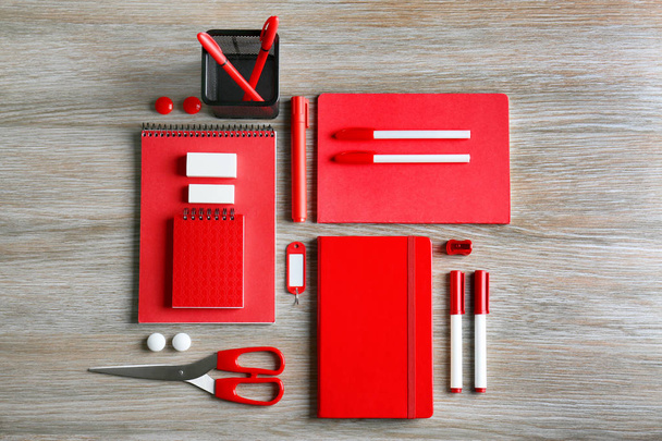 red stationery on wooden table - Fotografie, Obrázek