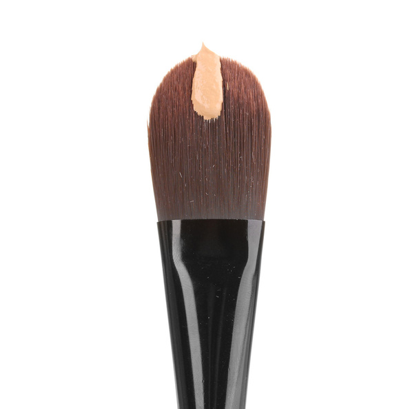 Cosmetic liquid foundation and brush isolated on white - Фото, изображение