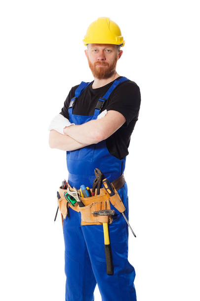 Hombre constructor en el uniforme con cinturón de construcción
 - Foto, Imagen