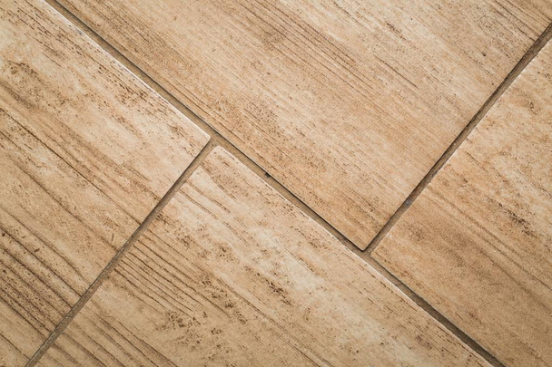 Close up van hout-achtige vloer tegel - Foto, afbeelding