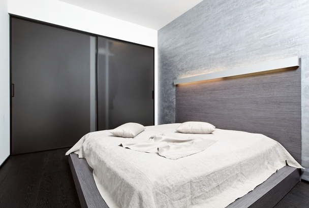 Modern minimalism style bedroom interior in beige tones - Foto, Imagen
