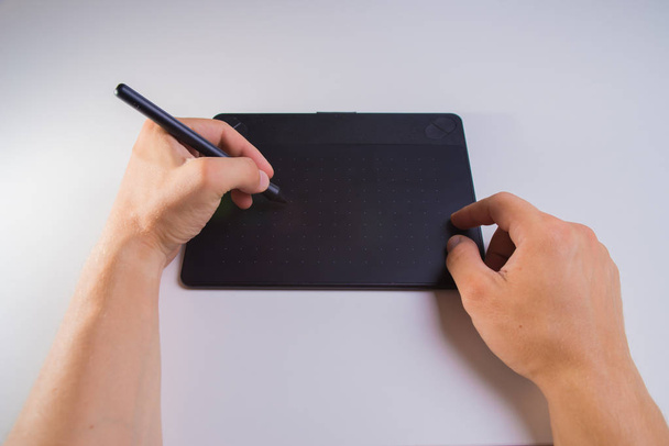 Graphics tablet in hands - Photo, Image
