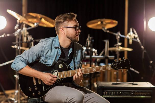 man playing guitar at studio rehearsal - Foto, Imagem
