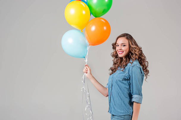 girl with bunch of colorful balloons - Foto, Bild