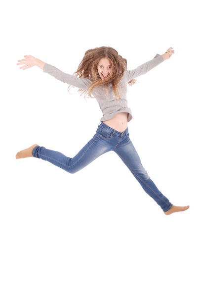 Teenage girl is jumping. - Фото, зображення