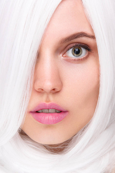 (Portrait of a young beautiful woman with creative makeup and white wig in studio  - Foto, Imagem
