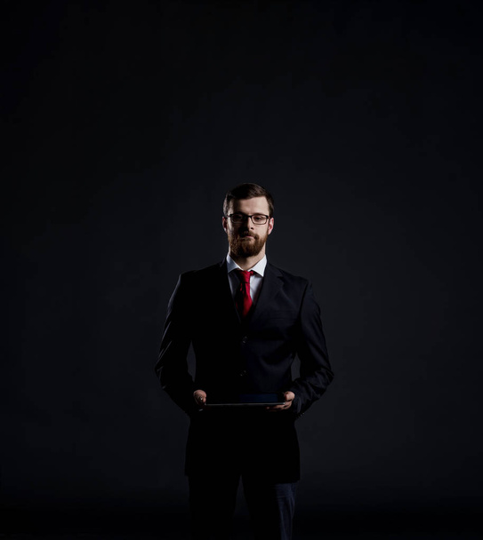 young businessman in black suit - Foto, Bild