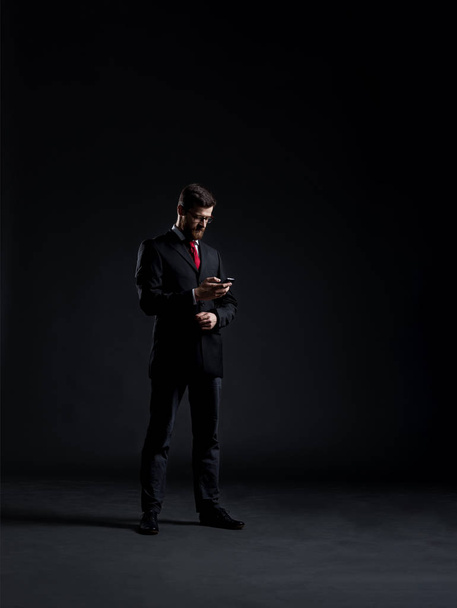 young businessman in black suit - Zdjęcie, obraz