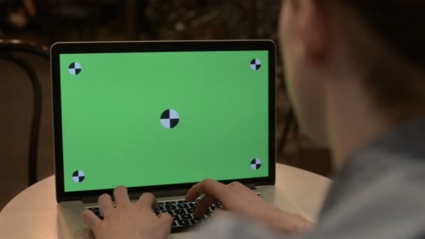 typing on a laptop with green screen - Video